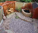 Low maintainence Landscape Design with seating, pond and walkways